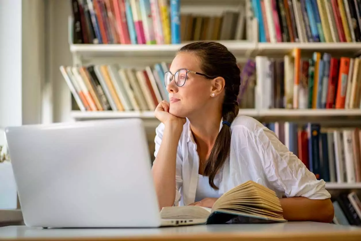 Adult woman with ADHD struggling to concentrate on her work. Adult woman with ADHD struggling to concentrate on her work.