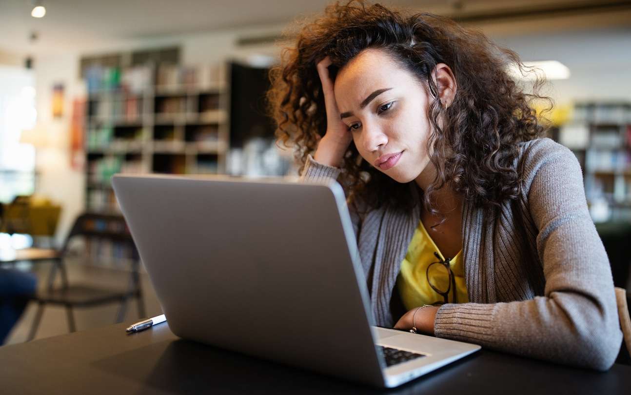 Woman struggling to concentrate at work or school due to Adult ADHD.