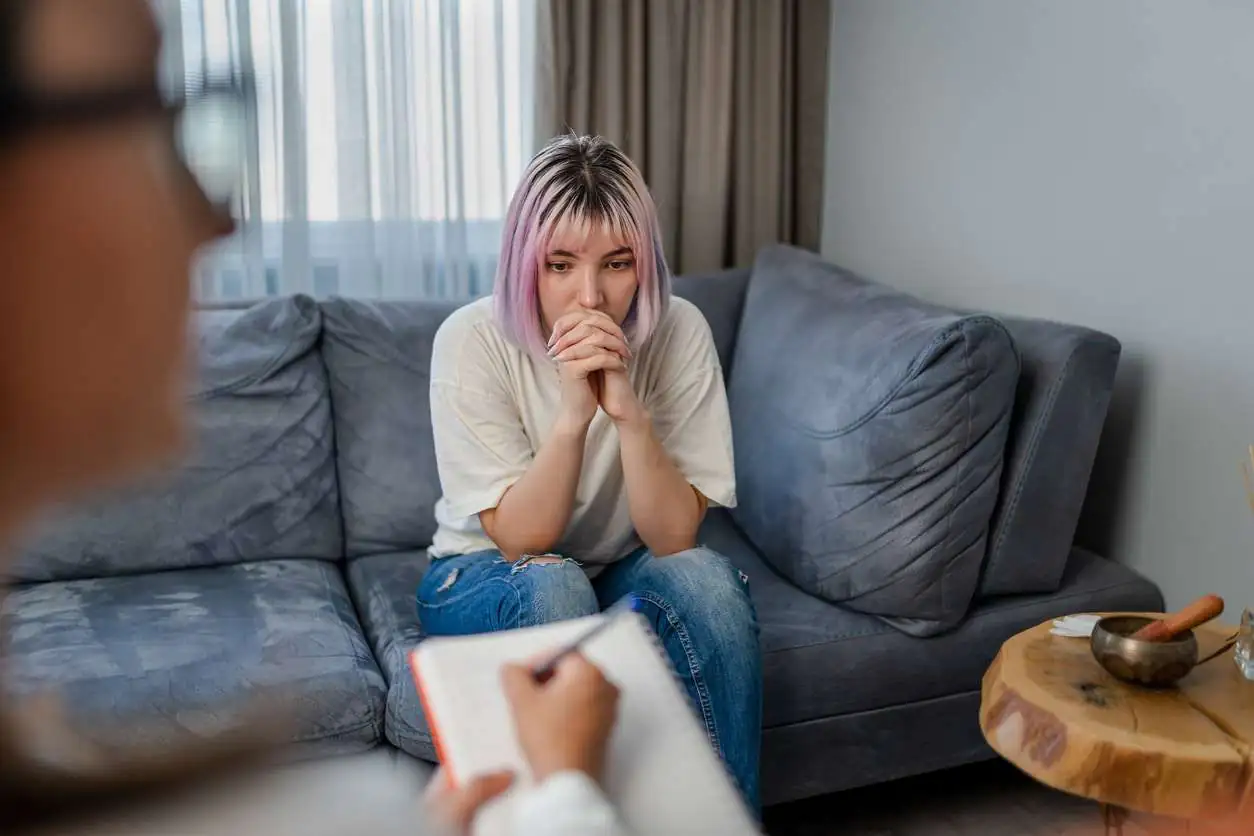 Hopeless Young woman talking with her Therapist Hopeless Young woman talking with her Therapist